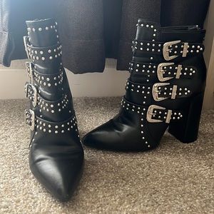 Black boots studded with buckles